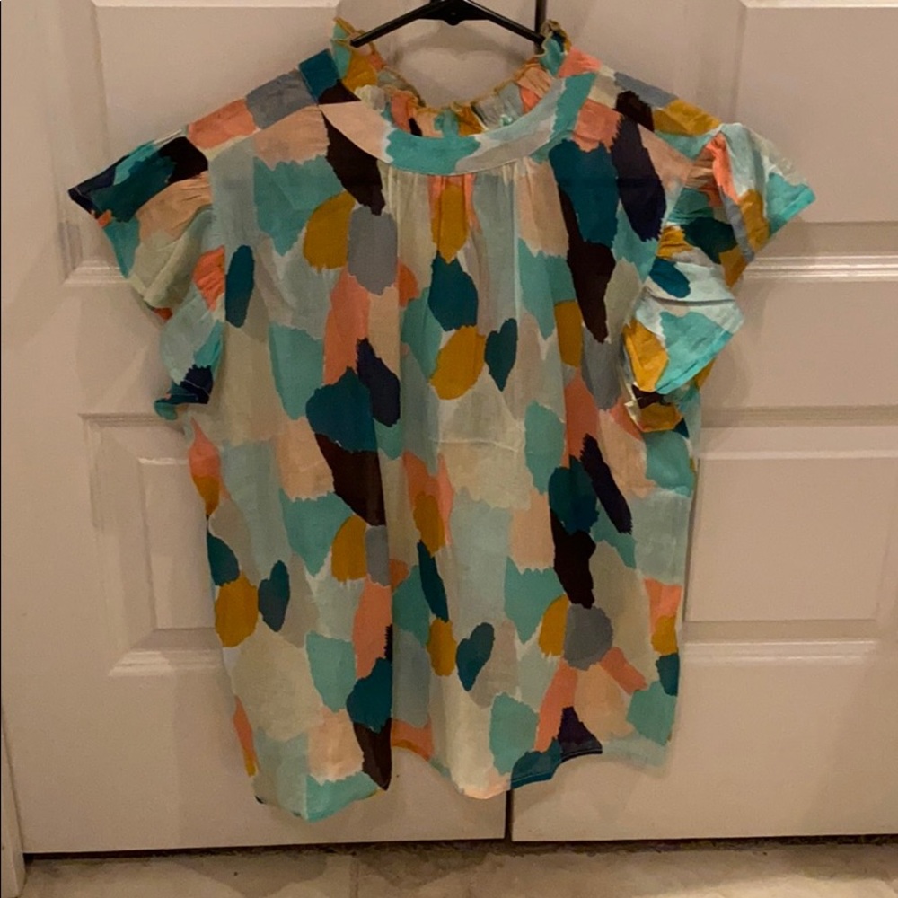 Cute flutter sleeve shirt.